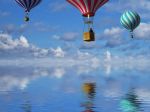 3d balloons in the blue sky and reflection in water